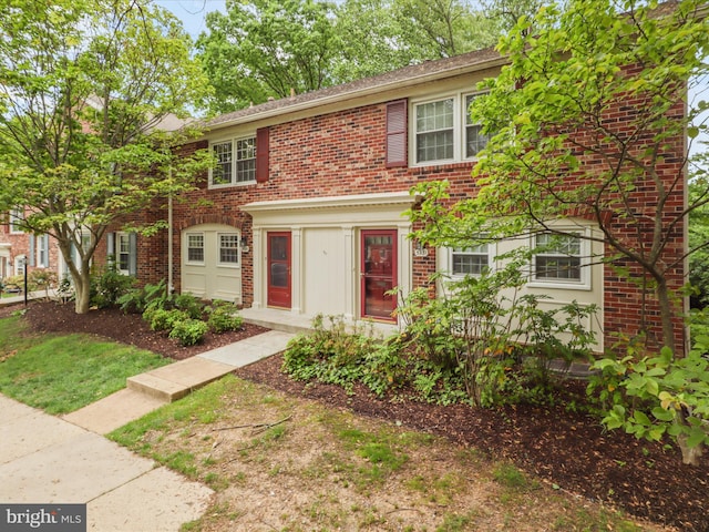 view of property with brick siding