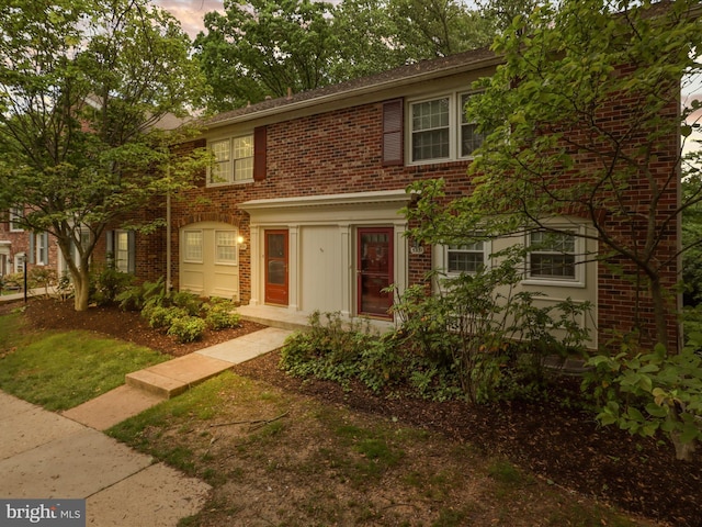 view of front of home with brick siding