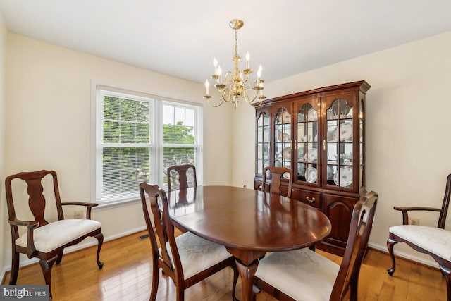 1276 Mason Mill Ct, Herndon, VA 20170 - dining room featuring a chandelier, light wood finished floors, and baseboards