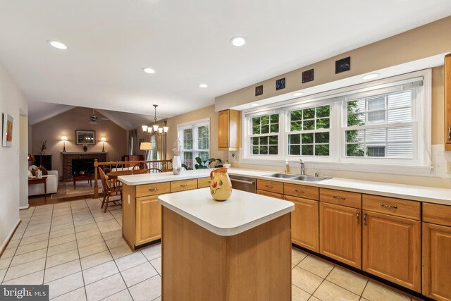 1276 Mason Mill Ct, Herndon, VA 20170 - kitchen with a sink, light tile patterned floors, light countertops, a brick fireplace, and a peninsula