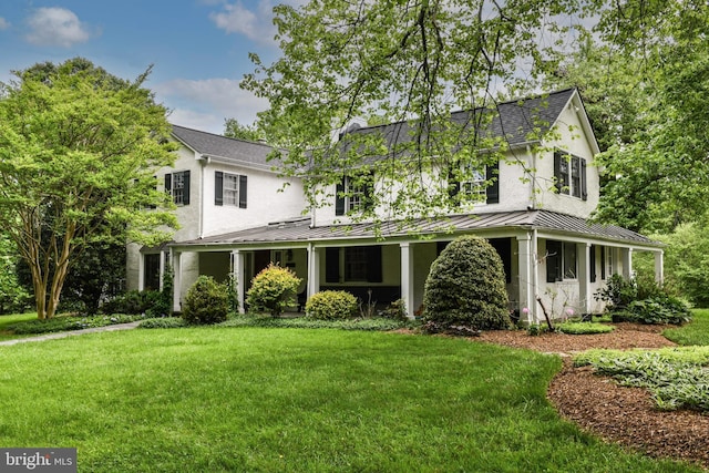 1435 Hunter View Farms, Vienna, VA 22182 - view of front of house with a standing seam roof, a front yard, stucco siding, and metal roof