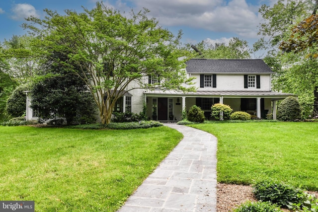 1435 Hunter View Farms, Vienna, VA 22182 - view of front of home with a standing seam roof, a front yard, metal roof, stucco siding, and roof with shingles