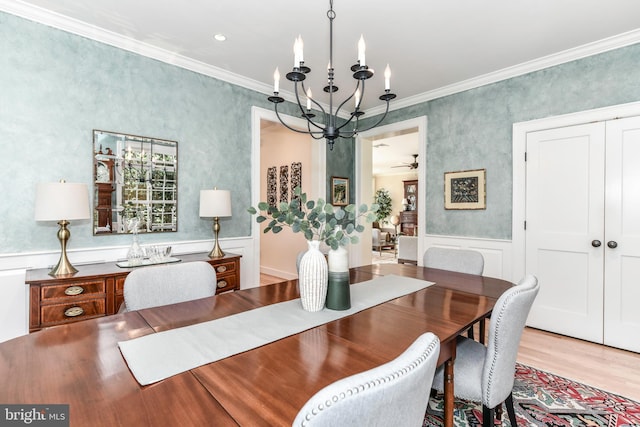 1435 Hunter View Farms, Vienna, VA 22182 - dining space with a chandelier, ornamental molding, wood finished floors, a wainscoted wall, and a decorative wall