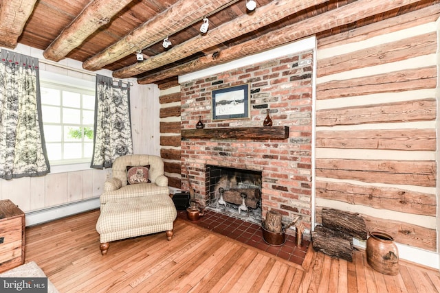 1435 Hunter View Farms, Vienna, VA 22182 - living room featuring a baseboard radiator, wooden ceiling with exposed beams, rail lighting, hardwood / wood-style flooring, and a brick fireplace