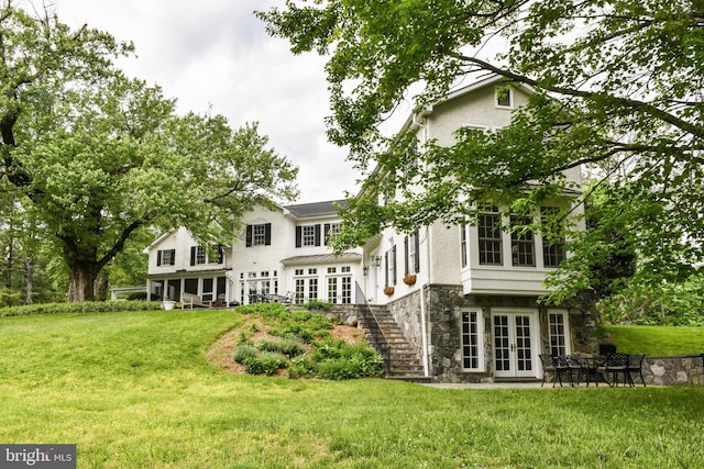 1435 Hunter View Farms, Vienna, VA 22182 - back of property with french doors, stone siding, a yard, and stairway