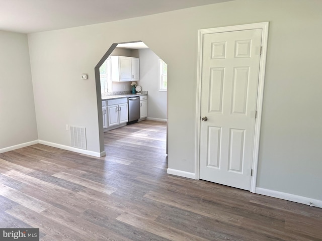 20 Flying Dove Ln, Hedgesville, WV 25427 - unfurnished room with baseboards, arched walkways, and wood finished floors