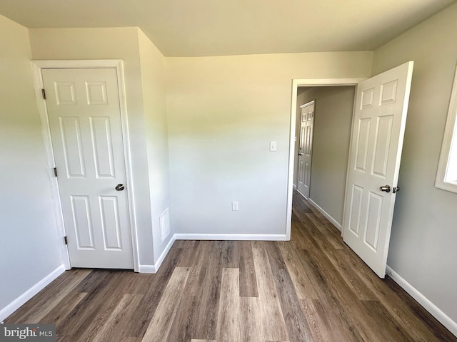 20 Flying Dove Ln, Hedgesville, WV 25427 - unfurnished bedroom featuring dark wood-type flooring and baseboards