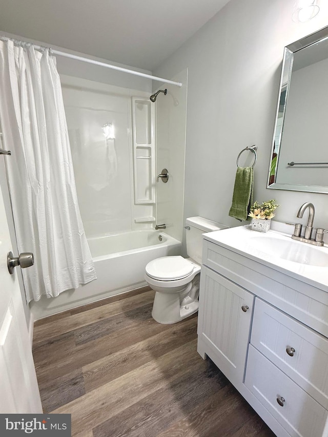 20 Flying Dove Ln, Hedgesville, WV 25427 - full bath featuring wood finished floors, toilet, shower / bathtub combination with curtain, and vanity