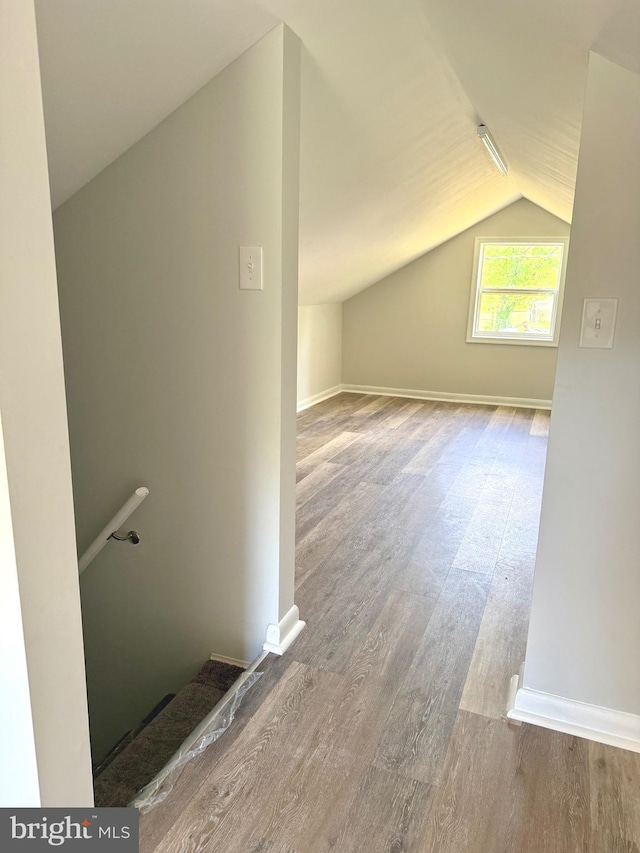 20 Flying Dove Ln, Hedgesville, WV 25427 - additional living space featuring lofted ceiling, wood finished floors, and baseboards