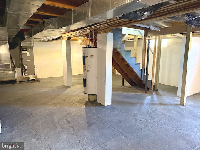 20 Flying Dove Ln, Hedgesville, WV 25427 - unfinished basement featuring electric water heater, stairway, and concrete block wall