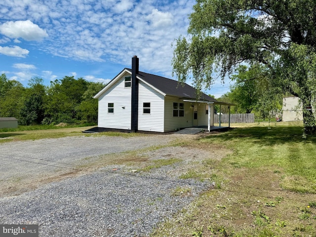 20 Flying Dove Ln, Hedgesville, WV 25427 - rear view of property featuring a chimney and driveway