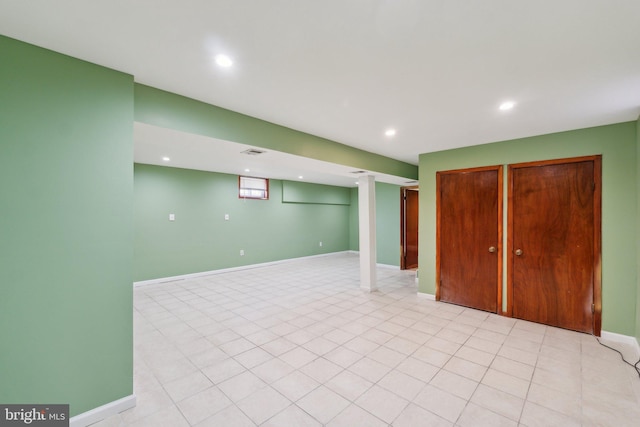 finished basement with recessed lighting and baseboards