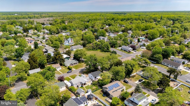 aerial view of residential area with a forest