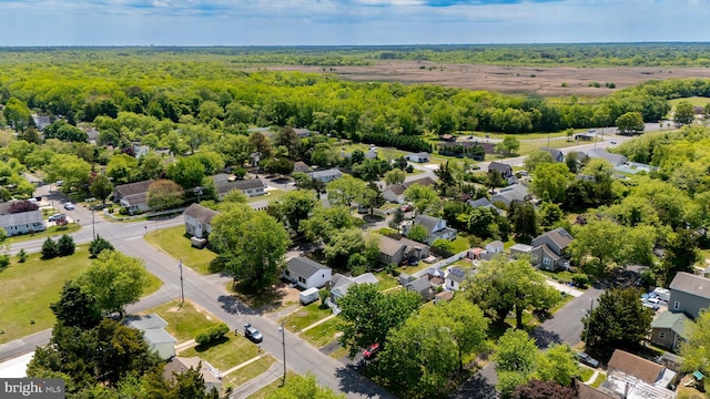 aerial perspective of suburban area with a heavily wooded area