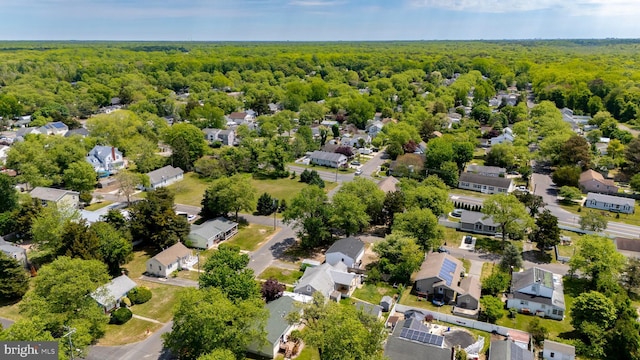 aerial perspective of suburban area with a heavily wooded area
