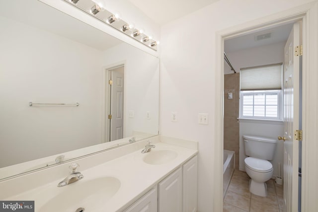 bathroom with toilet, double vanity, tile patterned flooring, and  shower combination