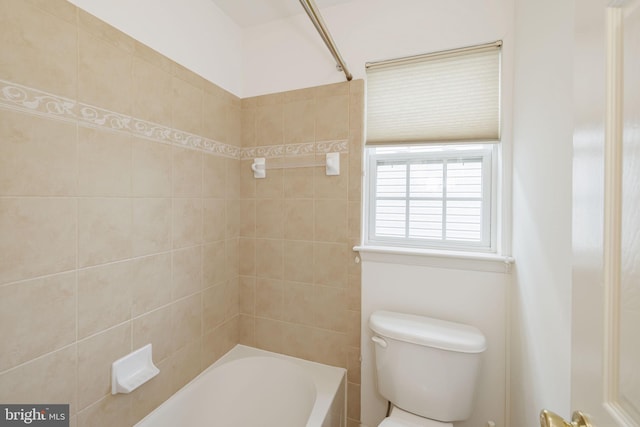bathroom featuring toilet and tub / shower combination
