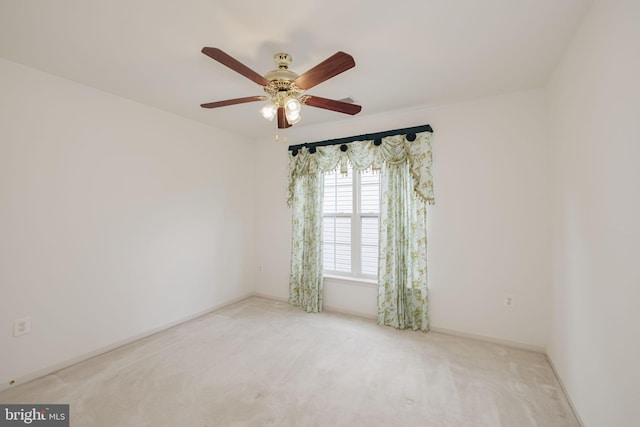 unfurnished room with ceiling fan and carpet floors