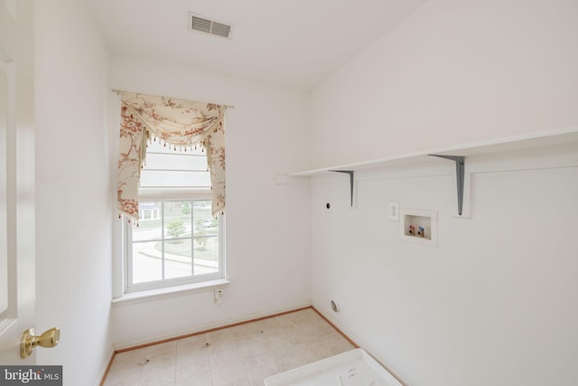 clothes washing area featuring hookup for a washing machine, hookup for an electric dryer, and baseboards