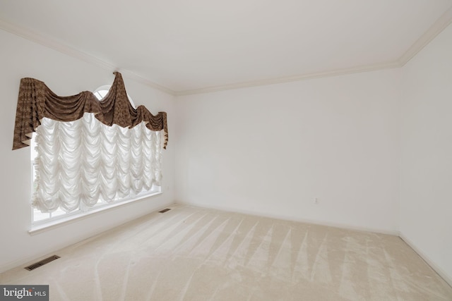carpeted empty room with ornamental molding