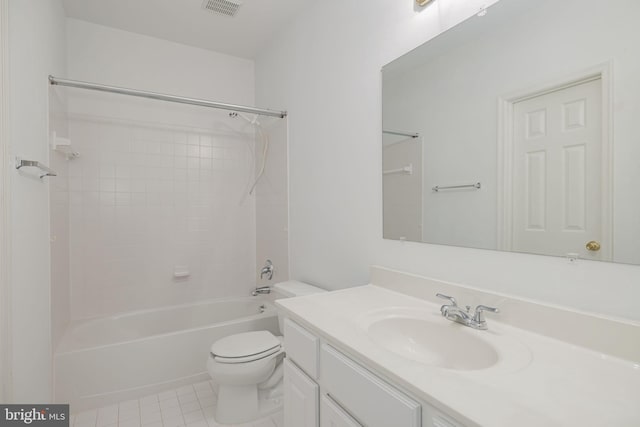 bathroom with toilet, vanity, tile patterned floors, and shower / bathtub combination