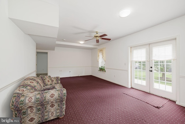unfurnished room with carpet flooring, french doors, and a ceiling fan