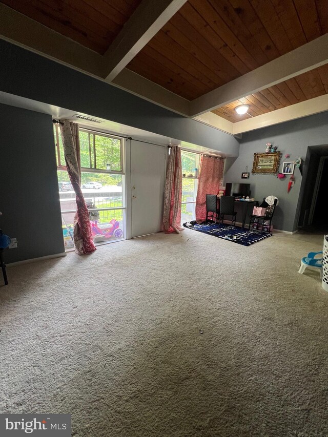 living area featuring wooden ceiling, carpet, and beamed ceiling