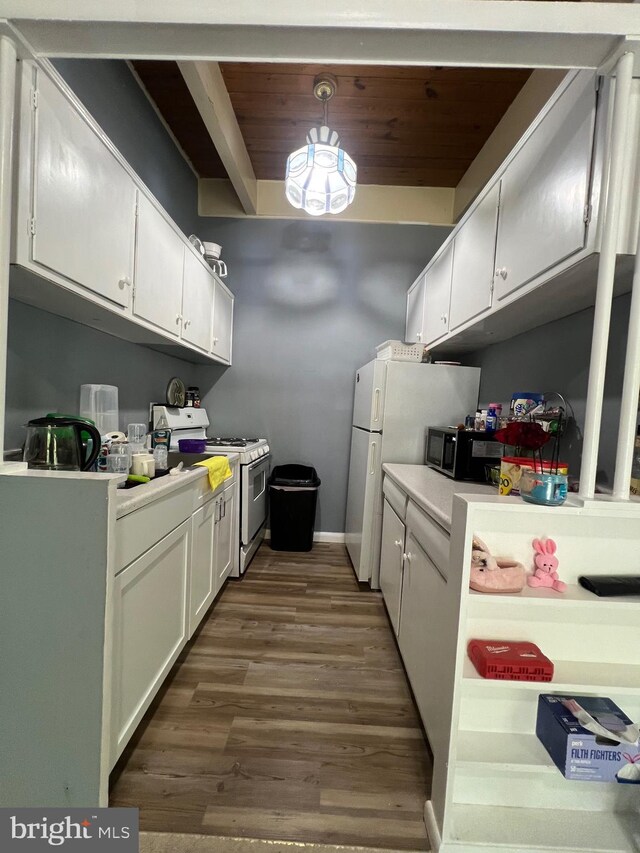 kitchen featuring white appliances, dark wood-style flooring, light countertops, white cabinetry, and wood ceiling