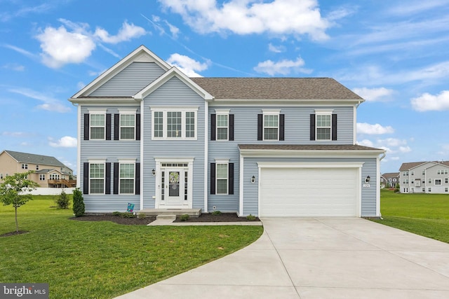 220 Ladysmith Dr, Stephens City, VA 22655 - view of front of house with an attached garage, concrete driveway, a front yard, and roof with shingles