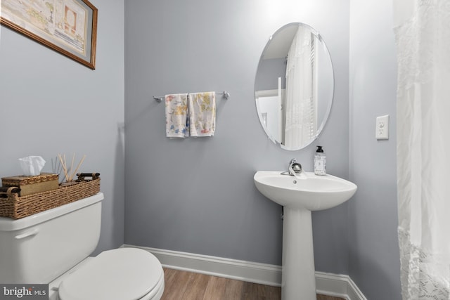 220 Ladysmith Dr, Stephens City, VA 22655 - bathroom featuring wood finished floors, toilet, baseboards, and a sink