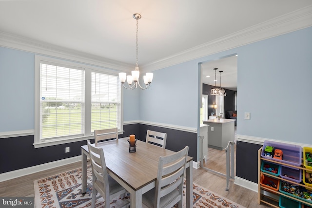 220 Ladysmith Dr, Stephens City, VA 22655 - dining space with a chandelier, light wood-style flooring, ornamental molding, and baseboards