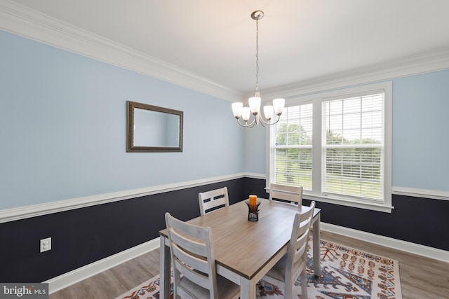 220 Ladysmith Dr, Stephens City, VA 22655 - dining room featuring a chandelier, wood finished floors, baseboards, and ornamental molding