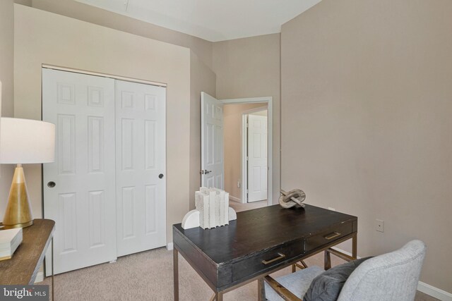 home office with carpet floors and baseboards