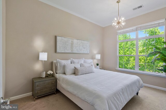 bedroom featuring carpet flooring, a chandelier, baseboards, and crown molding