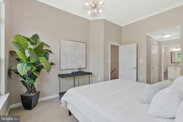 bedroom with carpet, crown molding, a chandelier, baseboards, and ensuite bath