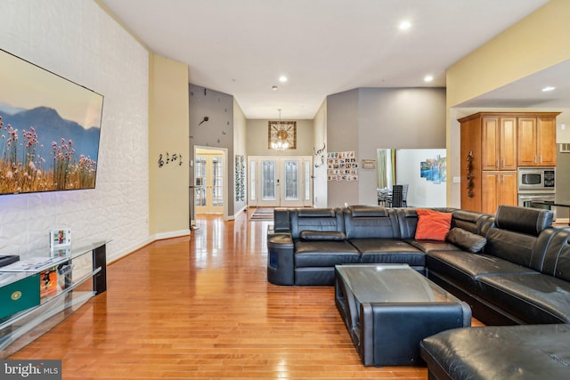 13716 Molly Berry Rd, Brandywine, MD 20613 - living area with light wood finished floors, recessed lighting, and a towering ceiling