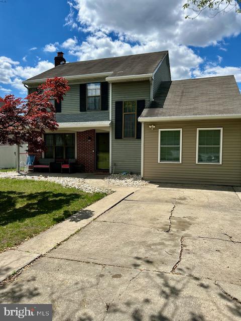 2513 Oakley Pl, Pennsauken, NJ 08109 - view of front of property with a chimney, a patio, and a front lawn