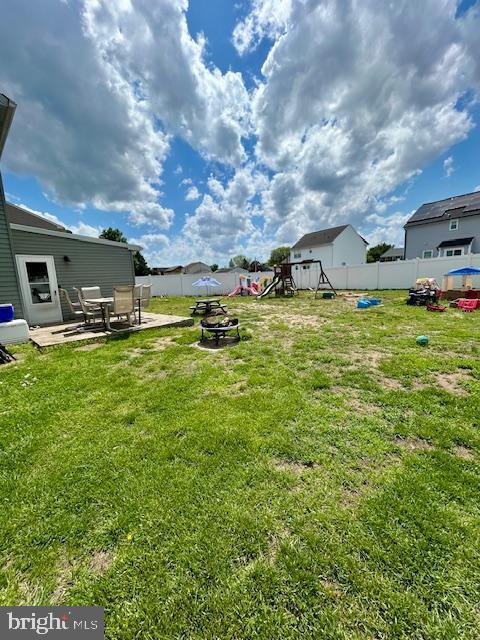2513 Oakley Pl, Pennsauken, NJ 08109 - view of yard with a playground, a patio, and an outdoor fire pit