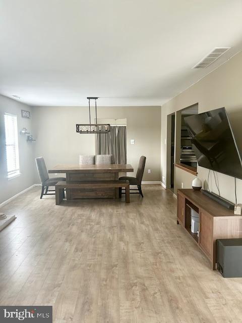 2513 Oakley Pl, Pennsauken, NJ 08109 - dining area with baseboards and light wood-style floors