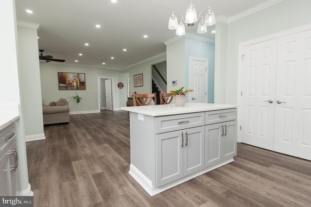 kitchen featuring open floor plan, recessed lighting, dark wood-type flooring, light countertops, and a ceiling fan