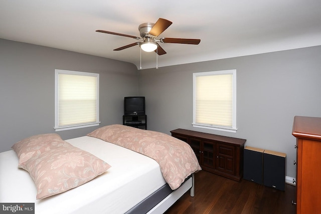 bedroom featuring dark wood-style flooring and a ceiling fan