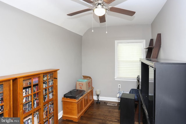 home office with a ceiling fan, dark wood-style floors, baseboards, and lofted ceiling