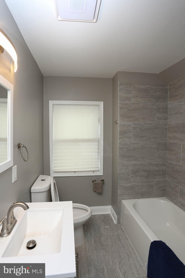 full bath featuring toilet, baseboards, and vanity