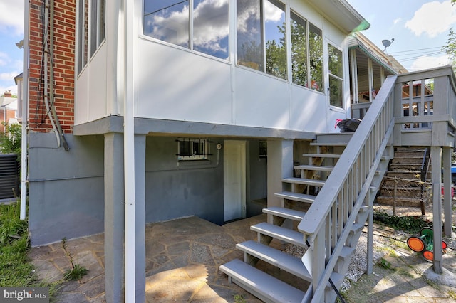 entrance to property with brick siding