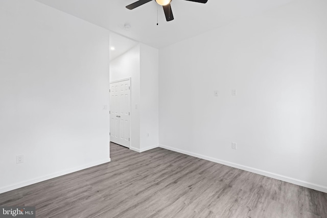 2118 Wilkens Ave, Baltimore, MD 21223 - unfurnished room featuring a ceiling fan, wood finished floors, and baseboards