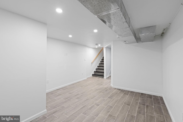 2118 Wilkens Ave, Baltimore, MD 21223 - finished below grade area featuring baseboards, recessed lighting, stairway, and wood finished floors