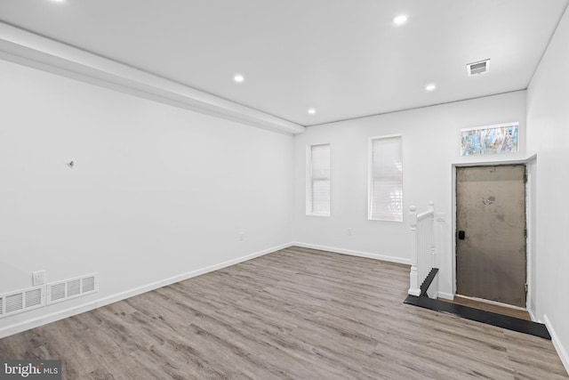 2118 Wilkens Ave, Baltimore, MD 21223 - spare room with wood finished floors, recessed lighting, baseboards, and healthy amount of natural light