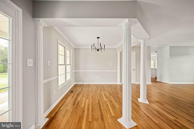 11490 Tilia Ln, Bealeton, VA 22712 - unfurnished dining area featuring plenty of natural light, crown molding, baseboards, and light wood-style floors