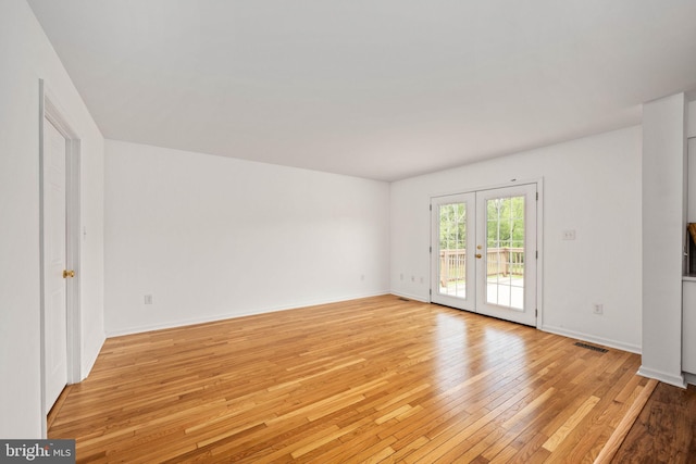 11490 Tilia Ln, Bealeton, VA 22712 - spare room featuring light wood-type flooring, french doors, and baseboards