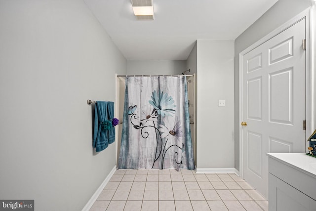 11490 Tilia Ln, Bealeton, VA 22712 - bathroom with tile patterned floors, baseboards, vanity, and a shower with curtain